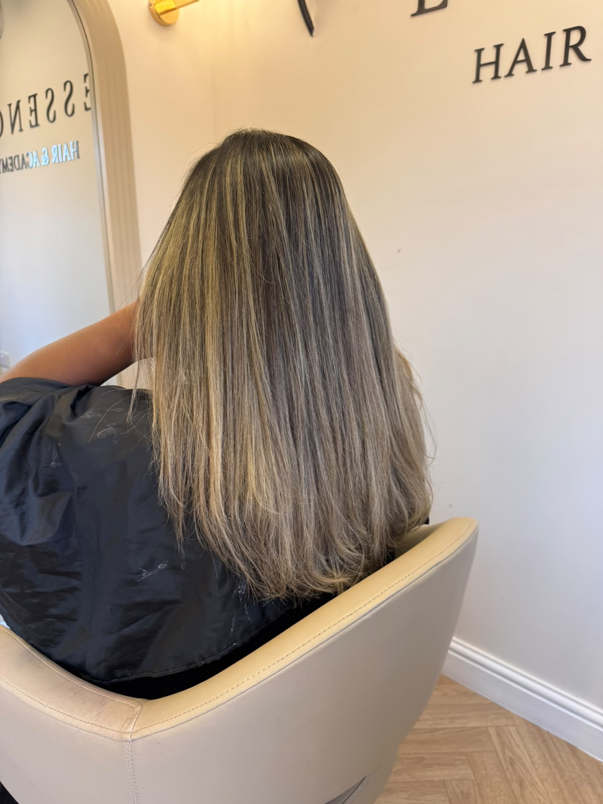 Ash-bronde balayage on straight, mid-length hair