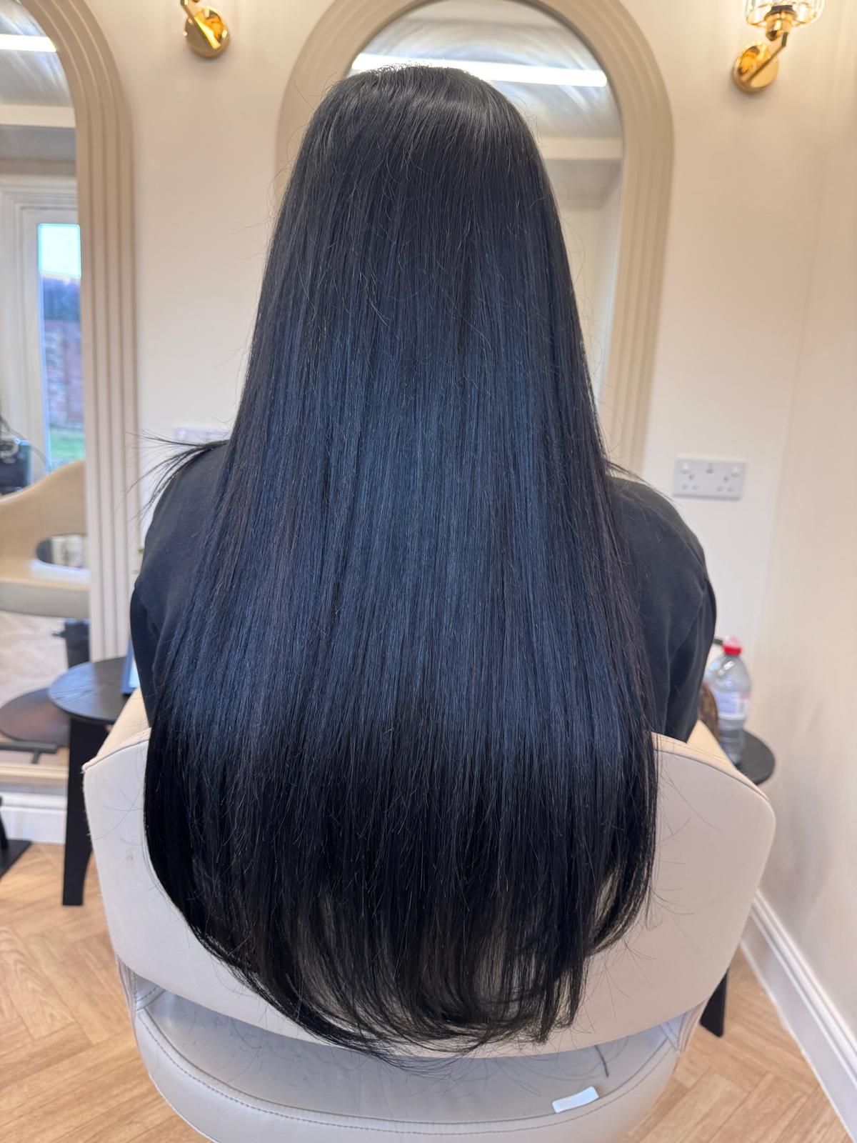 Long, sleek jet-black hair with nano ring extensions